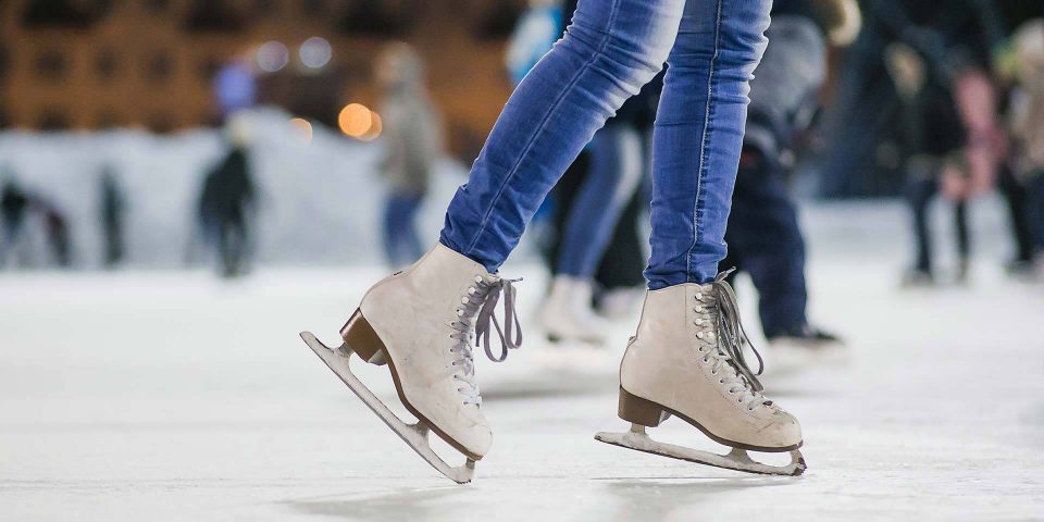 KLA ice rink project displayed by a skater wearing jeans and white ice skates